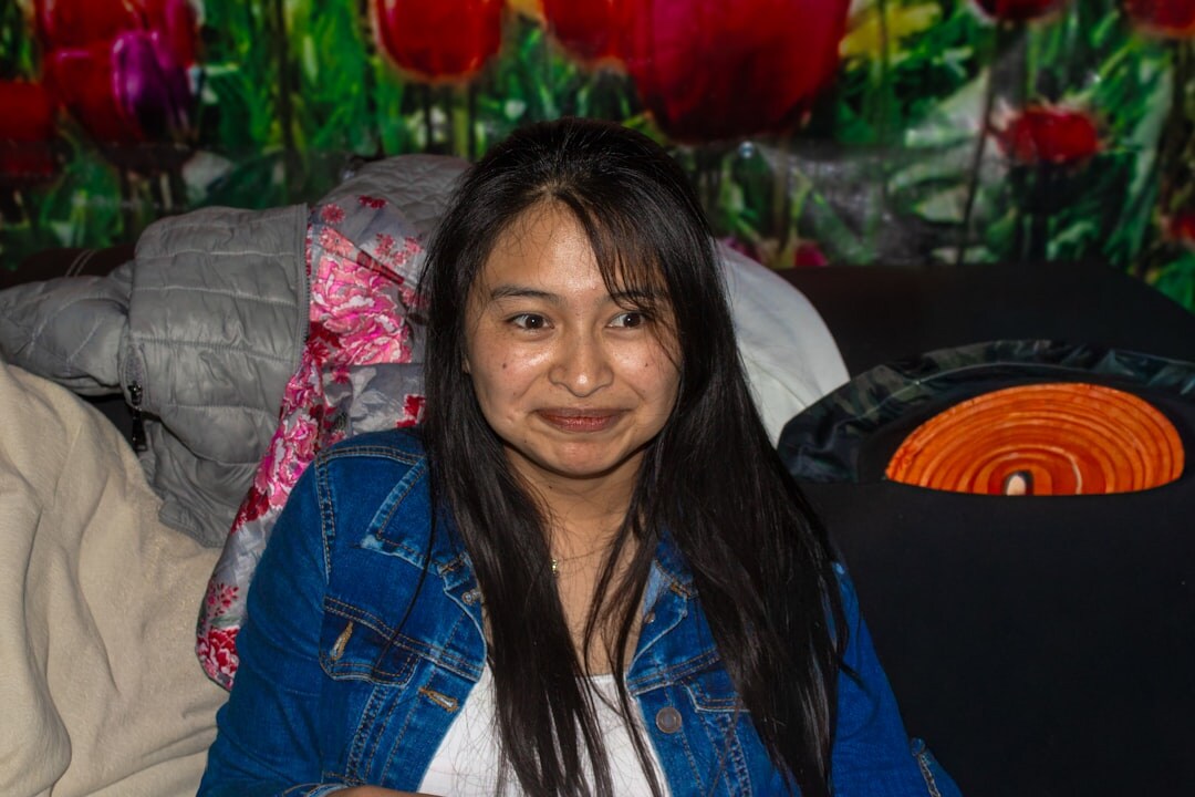 Studio portrait of a young Mexican woman software instructor smiling