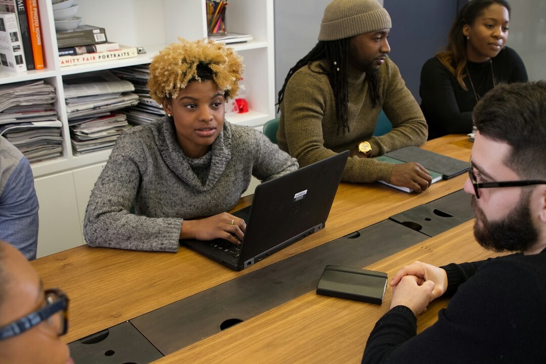 diverse group of students coding together